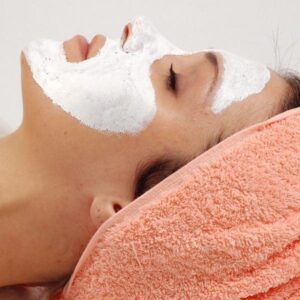 A woman with facial mask on her face.