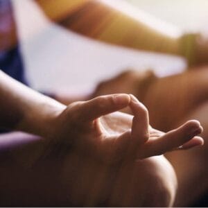 A person is doing yoga in the sun.